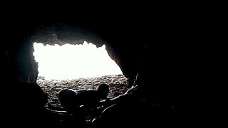 Couple recorded at the beach, inside the cave