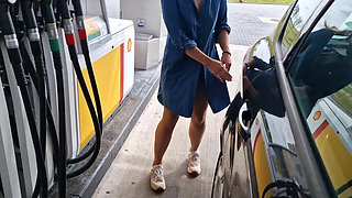 She Is Refueling at the Gas Station, Showing Her Tits and Pussy