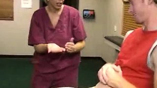 Milf Carey Riley strokes a young guys dick in the office