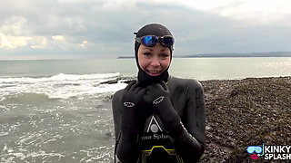 Rubbery Beach Encounter: Lucy's Neoprene Pussy Play with Stranger