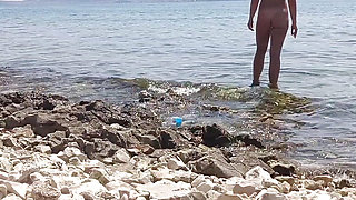 Stepbrother watches his stepsister naked on the beach and masturbates