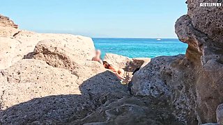 Amateur Italian girl gives public handjob on nude beach - skinny petite teen flashes tits and big cock