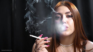 Seductive Russian Redhead Smoking in Corset