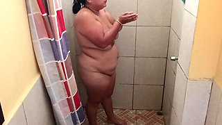 Taking a shower in a public restroom.