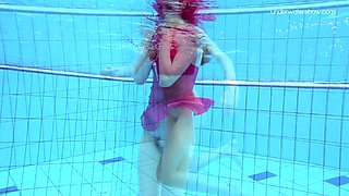 Redhead stunner Anna Netrebko bathing in a pool