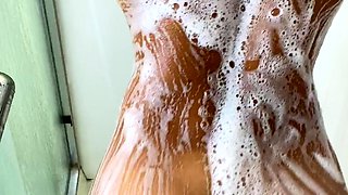 Busty curly brunette with big boobs fucks on couch