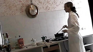 A beautiful blonde waits for her husband to come home from