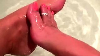 Sexy leggy brunette enjoys foot fetish