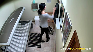 Czech solarium 120: brunette babe plays with her pussy for the camera