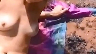 Slippery Naked Sunbathing Turns Into a Naughty Solo