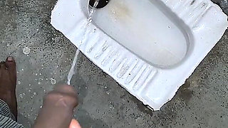 Desi Bhabhi Holding Stepbrother-in-law's Penis and Making Him Pee and Peeing Herself