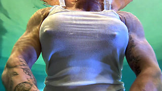 Amazon Kandy Flexes Her Massive Biceps in Her Hotel Pool