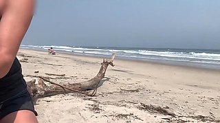 Busty MILF In Green Bikini Handjobs Her Partner On A Public Beach