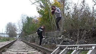 Teen girlfriends urinating on the railway