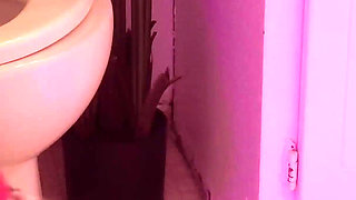 Emily pissing in the bathroom