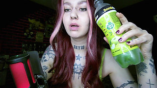 Sexy Alternative Redhead Drinking Soda and Burping
