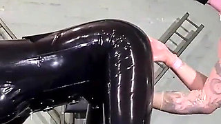 Latex Nurse inspects her gimp patient