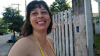 Amateur wife teasing you outside wearing a micro bikini