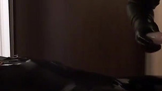 Oil body in latex catsuit