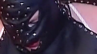 Mature Leather Domme Binds Her Fishnet Slave