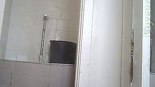 Brunette young stranger girl squats and pisses in the toilet