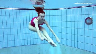 lovely anna is swimming in a pool in a sexy negligee and thongs