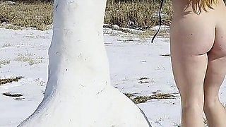 Redhead Slow Strip Rubbing Body on Snow Dick Sculpture