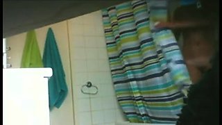 Shower voyeur spies on a sexy amateur girl with perky tits