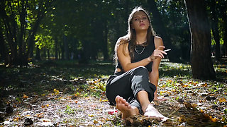 Seductive Russian Beauty Smoking Cigarette in Studio