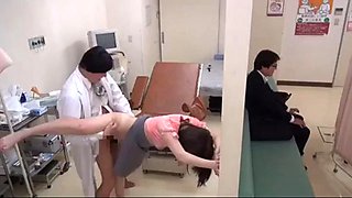 Gynecologist treating his female patient reproductive health