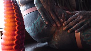 Gorgeous tattooed girl fucks her ass with a big dildo